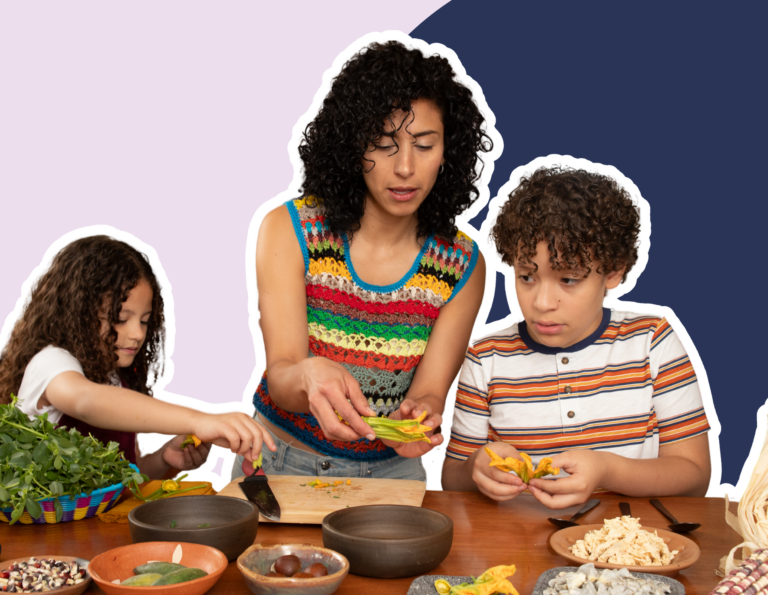 a mom prepares dinner with her daughter and son